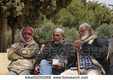 Stock Photo - Three Israeli Palestinians sitting on a bench on the Temple Mount, Muslim Quarter, Old City, Jerusalem, Israel, Middle East, Asia. Fotosearch