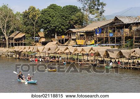 Tourists kayaking in the Water Fun Park on Nam Song River, Vang Vieng, Vientiane, Laos, Indochina, Asia View Large Photo Image Stock Photography - Tourists kayaking in the Water Fun Park on Nam Song River, Vang Vieng, Vientiane, Laos, Indochina, Asia. Fotosearch
