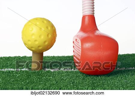 Toy plastic golf equipment, golf club and a golf ball on a hitting mat with a tee and artificial turf View Large Photo Image Stock Image - Toy plastic golf equipment, golf club and a golf ball on a hitting mat with a tee and artificial turf. Fotosearch