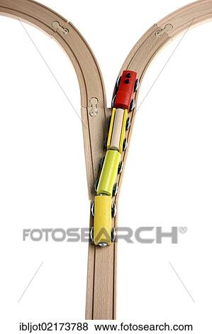 Toy wooden train at a switch, symbolic image for deciding the direction View Large Photo Image Stock Photo - Toy wooden train at a switch, symbolic image for deciding the direction. Fotosearch