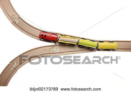 Toy wooden train at a switch, symbolic image for deciding the direction View Large Photo Image Stock Photo - Toy wooden train at a switch, symbolic image for deciding the direction. Fotosearch