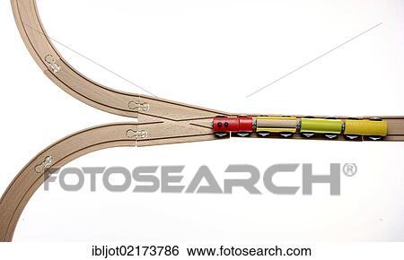 Toy wooden train at a switch, symbolic image for deciding the direction View Large Photo Image Stock Photograph - Toy wooden train at a switch, symbolic image for deciding the direction. Fotosearch