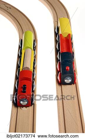 Toy wooden trains, two trains on the tracks, symbolic image of a race, competition View Large Photo Image Picture - Toy wooden trains, two trains on the tracks, symbolic image of a race, competition. Fotosearch