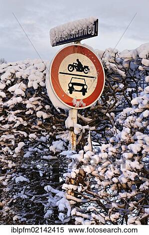 Stock Photography - Traffic sign covered in snow, no motorbikes and cars, Chiemgau, Upper Bavaria, Germany, Europe. Fotosearch