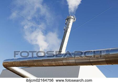 Stock Photograph - Tube transporting heat in front of thermal power plant, Erfurt, Thuringia, Germany, Europe. Fotosearch