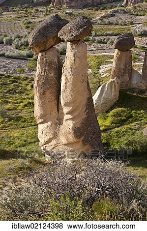 Tufa Fairy Chimneys with basalt blocks placed on top, rock formations at Cavushin, Goreme, UNESCO World Heritage Site, Cappadocia, Anatolia, Turkey, Asia View Large Photo Image Stock Photo - Tufa Fairy Chimneys with basalt blocks placed on top, rock formations at Cavushin, Goreme, UNESCO World Heritage Site, Cappadocia, Anatolia, Turkey, Asia. Fotosearch