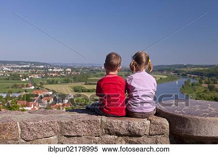 Stock Photography - Two children looking from Boselspitze Mountain into the Elbe Valley with the Elbe River, Soernewitz, Brockwitz and Coswig, Saxony, Germany, Europe. Fotosearch