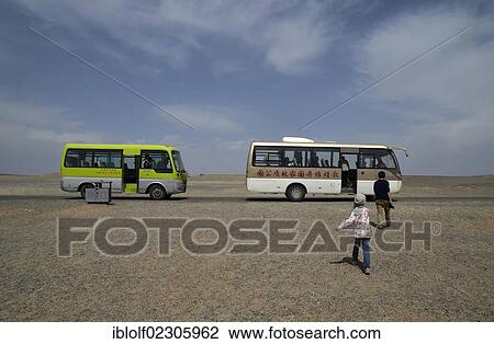 Two coaches in the dry desert landscape, historic Silk Road, Yumen Pass, Yadan National Park, Gansu, China, Asia View Large Photo Image Stock Image - Two coaches in the dry desert landscape, historic Silk Road, Yumen Pass, Yadan National Park, Gansu, China, Asia. Fotosearch