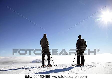 Two cross-country skiers enjoying the view from the summit of Feldberg Mountain towards Seebuck Mountain in the fog, Black Forest, Baden-Wuerttemberg, Germany, Europe, PublicGround, Europe View Large Photo Image Stock Photograph - Two cross-country skiers enjoying the view from the summit of Feldberg Mountain towards Seebuck Mountain in the fog, Black Forest, Baden-Wuerttemberg, Germany, Europe, PublicGround, Europe. Fotosearch