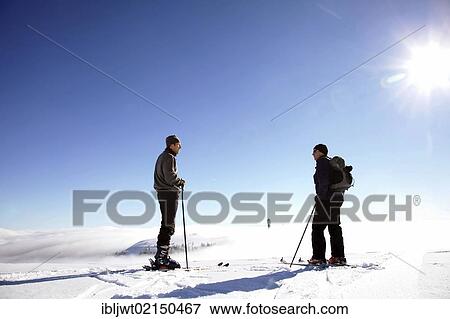 Two cross-country skiers having a conversation on the summit of Feldberg Mountain, Black Forest, Baden-Wuerttemberg, Germany, Europe, PublicGround, Europe View Large Photo Image Stock Photo - Two cross-country skiers having a conversation on the summit of Feldberg Mountain, Black Forest, Baden-Wuerttemberg, Germany, Europe, PublicGround, Europe. Fotosearch