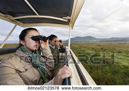 Two girls, about 13 and 18 years, looking for animals with binoculars, Lake Nakuru National Park, Kenya, East Africa, PublicGround, Africa View Large Photo Image Stock Photo - Two girls, about 13 and 18 years, looking for animals with binoculars, Lake Nakuru National Park, Kenya, East Africa, PublicGround, Africa. Fotosearch