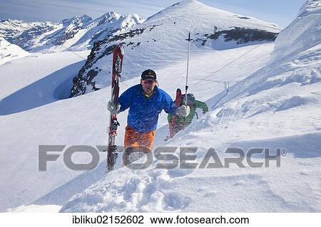 Stock Image - Two mountaineers on a skiing tour, ascent to the Schneejoch saddle, Wildstrubel region, Valais, Switzerland, Europe. Fotosearch