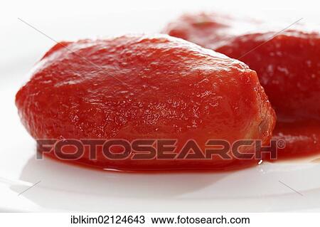Two peeled canned tomatoes, close-up View Large Photo Image Stock Image - Two peeled canned tomatoes, close-up. Fotosearch