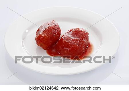 Two peeled canned tomatoes on white plate View Large Photo Image Stock Image - Two peeled canned tomatoes on white plate. Fotosearch