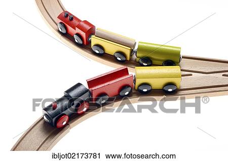 Two toy wooden trains moving in different directions after passing a switch View Large Photo Image Stock Image - Two toy wooden trains moving in different directions after passing a switch. Fotosearch