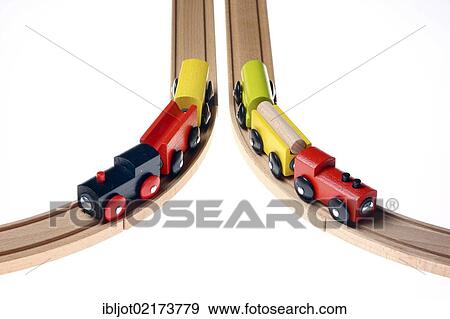 Two toy wooden trains moving in different directions after passing a switch View Large Photo Image Stock Photo - Two toy wooden trains moving in different directions after passing a switch. Fotosearch