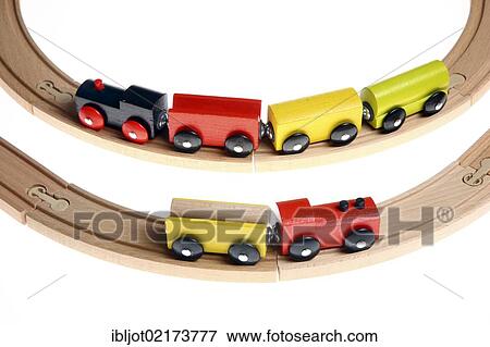 Two toy wooden trains on the tracks View Large Photo Image Stock Photo - Two toy wooden trains on the tracks. Fotosearch