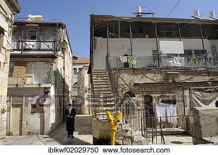 Ultra-Orthodox Jew with typical houses in the district of Me'a She'arim or Mea Shearim, Jerusalem, Israel, Middle East, Asia View Large Photo Image Stock Image - Ultra-Orthodox Jew with typical houses in the district of Me'a She'arim or Mea Shearim, Jerusalem, Israel, Middle East, Asia. Fotosearch