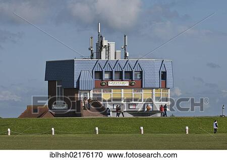 Stock Image - Utkiek, restaurant and café on the dyke, mobile phone masts on the roof, Norden, Norddeich, East Frisia, Lower Saxony, Germany, Europe. Fotosearch