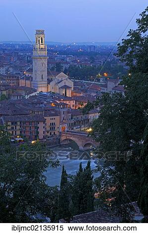 Stock Photography - Verona at dusk, with Duomo, cathedral and Ponte di petra stone bridge, Adige river, Veneto, Italy, Europe. Fotosearch