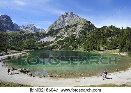 View across Seebensee lake to Mt Sonnenspitze, Ehrwald, Tyrol, Austria, Europe, PublicGround, Europe View Large Photo Image Stock Photo - View across Seebensee lake to Mt Sonnenspitze, Ehrwald, Tyrol, Austria, Europe, PublicGround, Europe. Fotosearch
