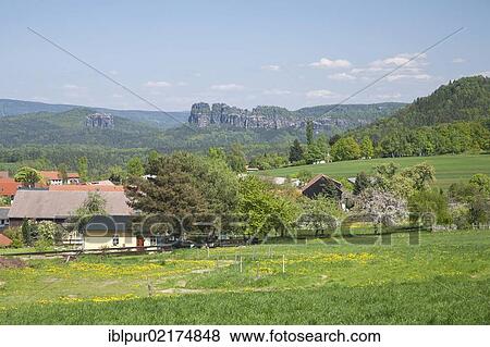 Stock Photo - View from the village of Papstdorf towards the Schrammsteine group of rocks, Elbe Sandstone Mountains, Saxony, Germany, Europe. Fotosearch