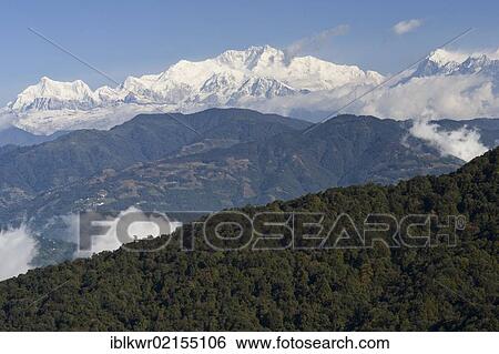 Stock Photograph - View from West Bengal, India, towards the Kangchenjunga on the border between Sikkim and Nepal, Asia. Fotosearch