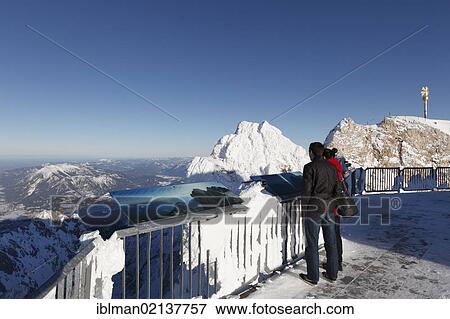 Stock Photo - View from Zugspitze Mountain with the summit cross, Wetterstein Mountains, Upper Bavaria, Bavaria, Germany, Europe. Fotosearch