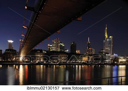 View under Holbeinsteg bridge across the River Main at the Frankfurt skyline at night, Frankfurt am Main, Hesse, Germany, Europe View Large Photo Image Stock Photo - View under Holbeinsteg bridge across the River Main at the Frankfurt skyline at night, Frankfurt am Main, Hesse, Germany, Europe. Fotosearch
