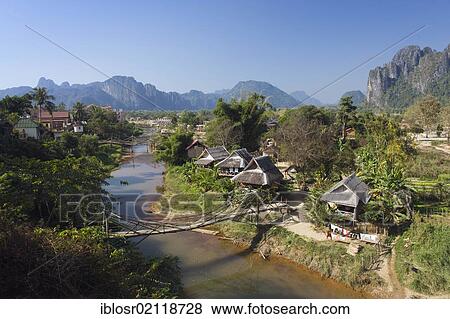 Stock Photo - Village, karst mountains, Nam Song river, Vang Vieng, Vientiane, Laos, Indochina, Asia. Fotosearch