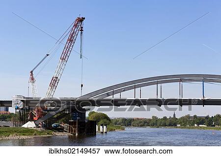 Stock Photo - Waldschloesschen Bridge construction site across the Elbe River in Dresden, its construction was responsible for the withdrawal of UNESCO World Cultural Heritage status in 2009, Dresden, Saxony, Germany, Europe. Fotosearch