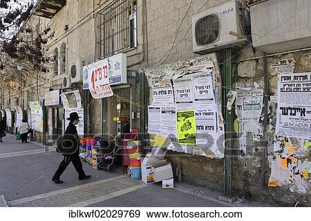 Wall newspapers and an Orthodox Jew in the district of Me'a She'arim or Mea Shearim, Jerusalem, Israel, Middle East, Asia View Large Photo Image Stock Photo - Wall newspapers and an Orthodox Jew in the district of Me'a She'arim or Mea Shearim, Jerusalem, Israel, Middle East, Asia. Fotosearch