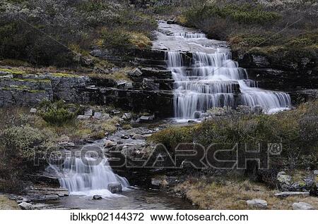 Stock Image - Waterfall in a fjell landscape, Ringebufjellet, Norway, Europe. Fotosearch