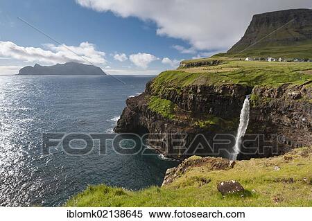 Waterfall into the sea, coast, view towards Mykines Island, Gásadalur, Vágar, Faroe Islands, Denmark, North Atlantic, Europe View Large Photo Image Stock Photography - Waterfall into the sea, coast, view towards Mykines Island, Gásadalur, Vágar, Faroe Islands, Denmark, North Atlantic, Europe. Fotosearch