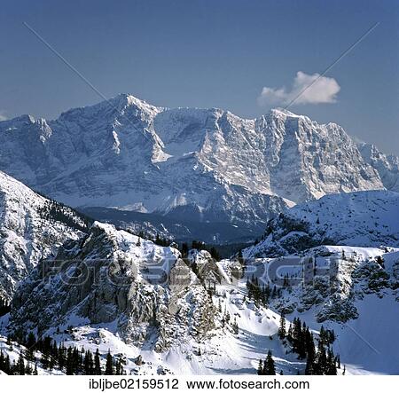 Stock Image - Wetterstein Mountains, Zugspitze Mountain, view from Brander Schroffen in winter, Tegelberg, Upper Bavaria, Bavaria, Germany, Europe. Fotosearch