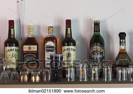 Stock Image - Whiskey bottles, Father Mcdyer Folk Museum, Glencolumbcille, also Glencolumbkille, County Donegal, Ireland, Europe. Fotosearch
