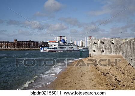 Stock Image - Wightlink Isle of Wight car ferry leaving Portsmouth Harbour past the round tower, Portsmouth, Hampshire, England, United Kingdom, Europe. Fotosearch