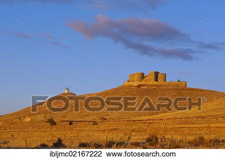 Stock Image - Windmill and Caballeros de San Juan de Jerusalen castle, Consuegra, Toledo province, Route of Don Quixote, Castilla-La Mancha, Spain, Europe. Fotosearch