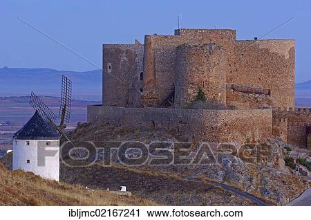 Stock Image - Windmill and Caballeros de San Juan de Jerusalen castle, Consuegra, Toledo province, Route of Don Quixote, Castilla-La Mancha, Spain, Europe. Fotosearch