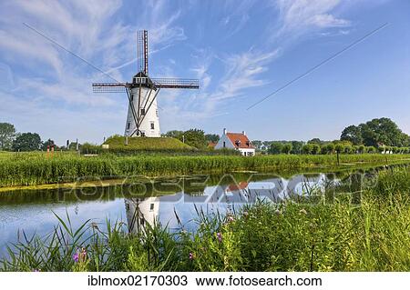 Windmill on the canal between Bruges and Damme, Damse Vaart-Zuid, Damme, Bruges, West Flanders, Flemish Region, Belgium, Europe View Large Photo Image Stock Image - Windmill on the canal between Bruges and Damme, Damse Vaart-Zuid, Damme, Bruges, West Flanders, Flemish Region, Belgium, Europe. Fotosearch