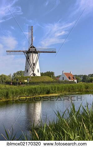 Windmill on the canal between Bruges and Damme, Damse Vaart-Zuid, Damme, Bruges, West Flanders, Flemish Region, Belgium, Europe View Large Photo Image Stock Image - Windmill on the canal between Bruges and Damme, Damse Vaart-Zuid, Damme, Bruges, West Flanders, Flemish Region, Belgium, Europe. Fotosearch