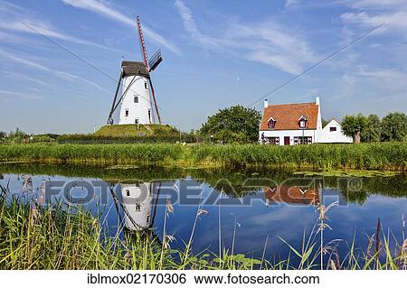 Windmill on the canal between Bruges and Damme, Damse Vaart-Zuid, Damme, Bruges, West Flanders, Flemish Region, Belgium, Europe View Large Photo Image Stock Photograph - Windmill on the canal between Bruges and Damme, Damse Vaart-Zuid, Damme, Bruges, West Flanders, Flemish Region, Belgium, Europe. Fotosearch