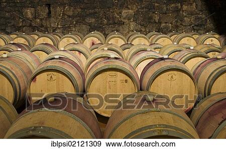 Stock Photo - Wine aging in oak barrels at winery in Bolzano, Bozen, Trentino-Alto Adige, Italy, Europe. Fotosearch