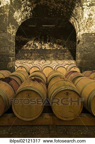 Wine aging in oak barrels in vaulted wine cellar in Bolzano, Bozen, Trentino-Alto Adige, Italy, Europe View Large Photo Image Stock Photo - Wine aging in oak barrels in vaulted wine cellar in Bolzano, Bozen, Trentino-Alto Adige, Italy, Europe. Fotosearch