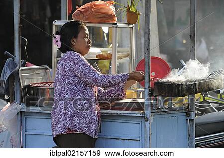 Woman, mobile food kitchen, market, Siem Reap, Cambodia, Southeast Asia, Asia View Large Photo Image Stock Photo - Woman, mobile food kitchen, market, Siem Reap, Cambodia, Southeast Asia, Asia. Fotosearch