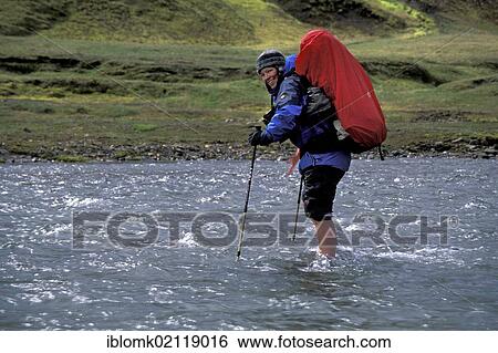 Woman with backpack crossing river, Álftavatn, Laugavegur hiking trail, Fjallabak nature reserve, highland, Iceland, Europe View Large Photo Image Stock Photograph - Woman with backpack crossing river, Álftavatn, Laugavegur hiking trail, Fjallabak nature reserve, highland, Iceland, Europe. Fotosearch