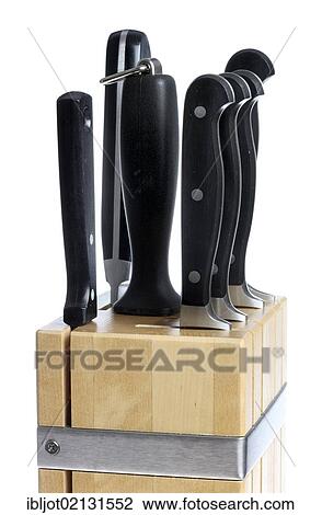 Stock Image - Wooden knife block with various kitchen knives. Fotosearch