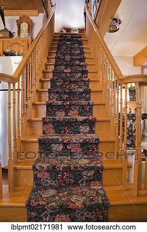 Wooden staircase between the kitchen and living room inside an old 1904 Victorian cottage style residential home, Quebec, Canada, North America View Large Photo Image Stock Image - Wooden staircase between the kitchen and living room inside an old 1904 Victorian cottage style residential home, Quebec, Canada, North America. Fotosearch