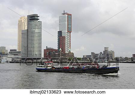 Stock Image - World Port Center Tower, Montevideo Tower and Hotel Cafe Restaurant New York, architecture at the Wilhelminapier and Rijn Haven, Rhine harbour, Nieuwe Maas River, Rotterdam, Holland, Nederland, the Netherlands, Europe. Fotosearch