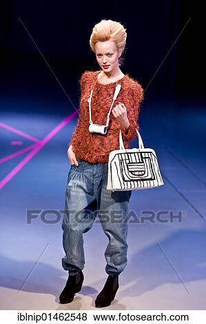 Stock Photo - Young lady showing casual clothes at Copenhagen International Fashion Fair, Copenhagen, Denmark, Europe. Fotosearch
